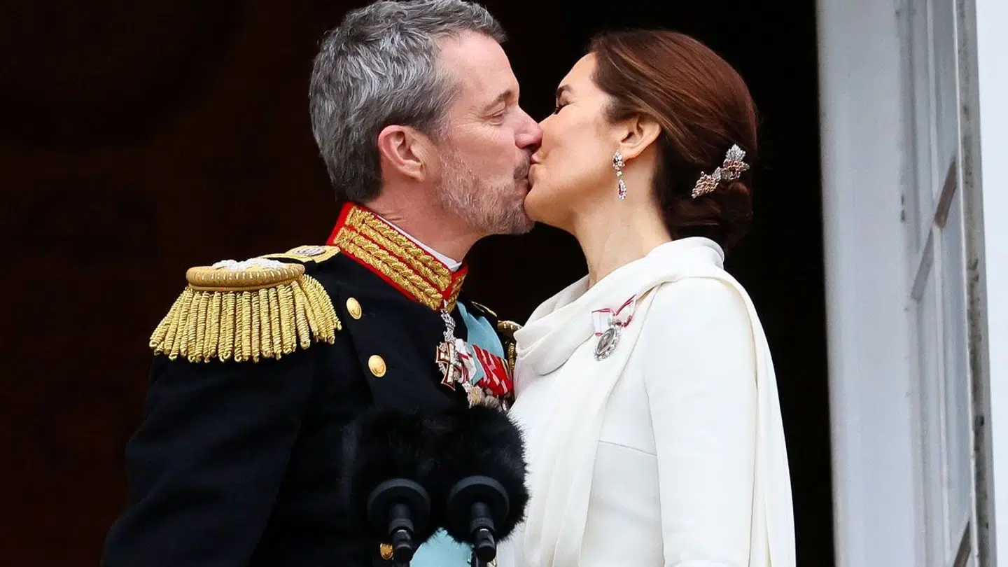 Denmark's newly proclaimed King Frederik and Queen Mary kiss on the balcony of Christiansborg Palace, following the abdication of former Queen Margrethe who reigned for 52 years, in Copenhagen, Denmark, January 14, 2024. REUTERS/Wolfgang Rattay